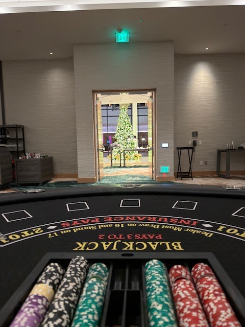 blackjack-table-casino-chips-closeup - The Main Event Company Blackjack table with organized rows of casino chips