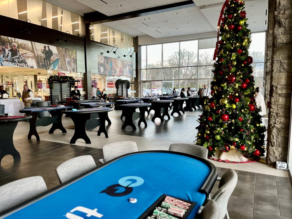 casino-table-setup-christmas-tree - The Main Event Company Casino table setup beside a decorated Christmas tree