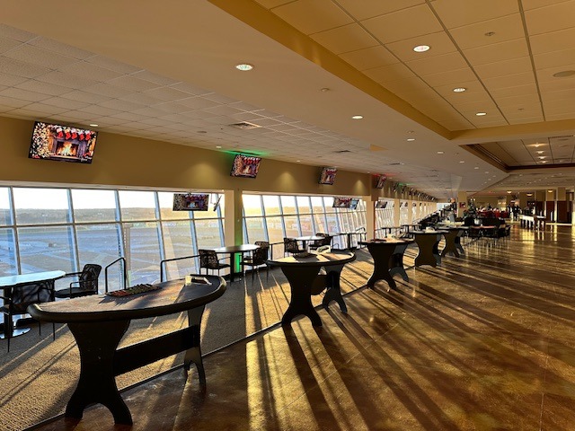 fundraising - The Main Event Company Casino tables arranged beside windows in an event venue