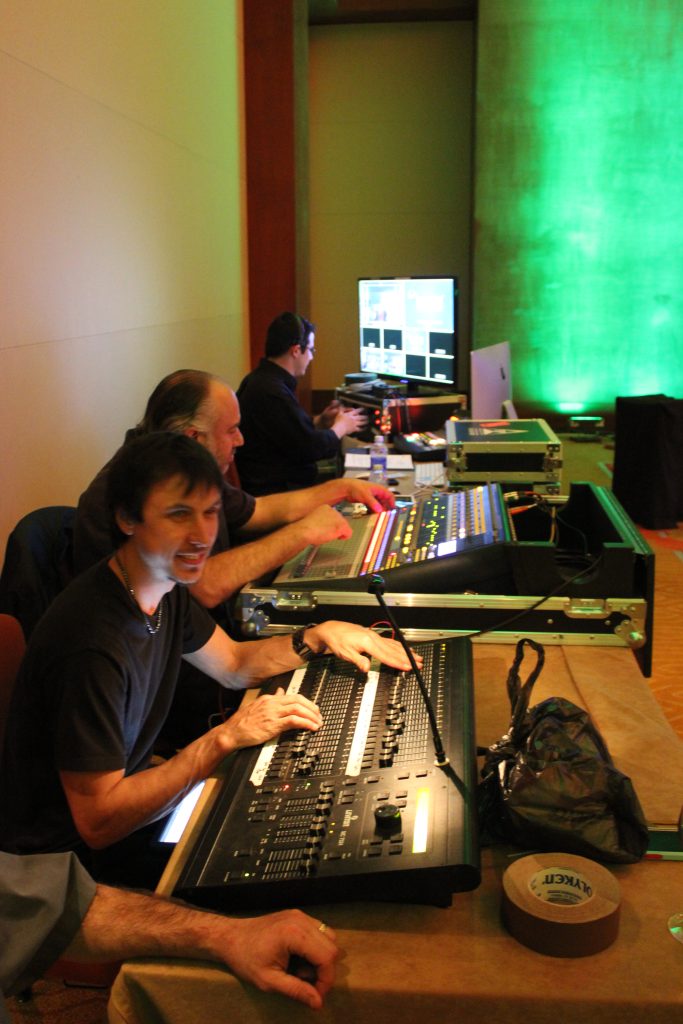 soung and audio visual - The Main Event Company Event production crew operating sound, lighting, and audiovisual control equipment